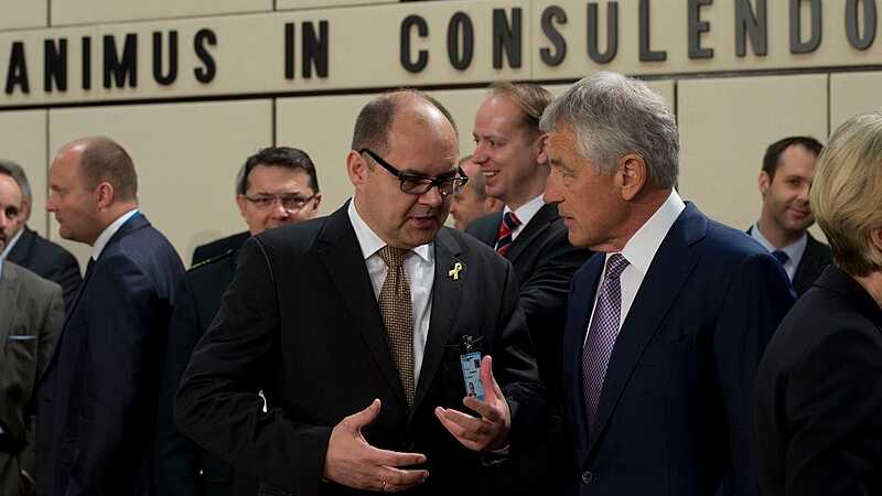 Secretary of Defense Chuck Hagel speaks with Germany's Christian Schmidt, tags: der - CC BY-SA